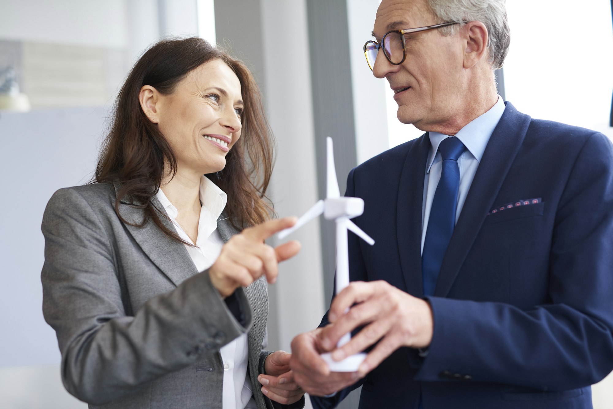 Business workers having a conversation about wind energy