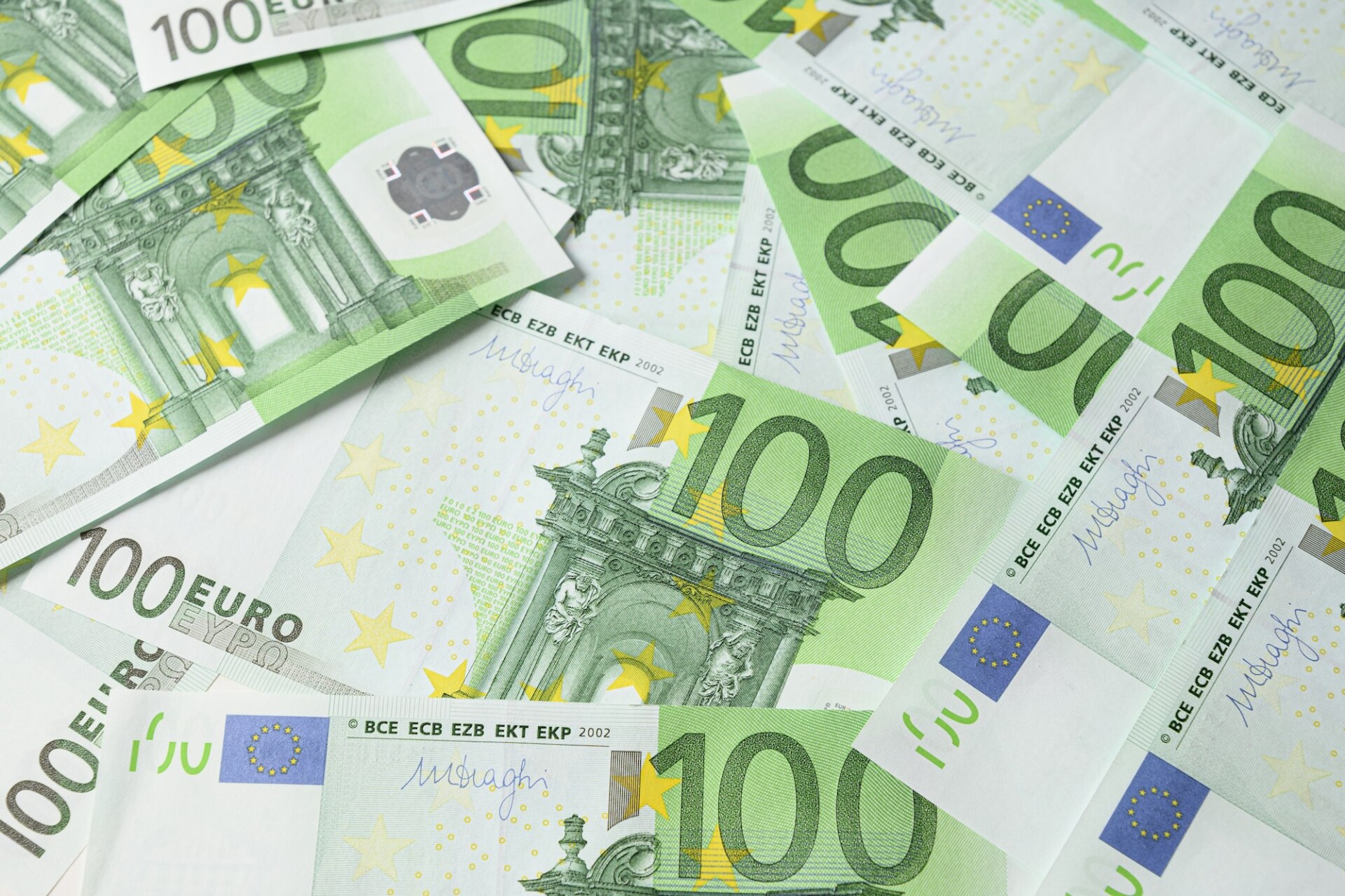 European money in banknotes of 100 euros as background.