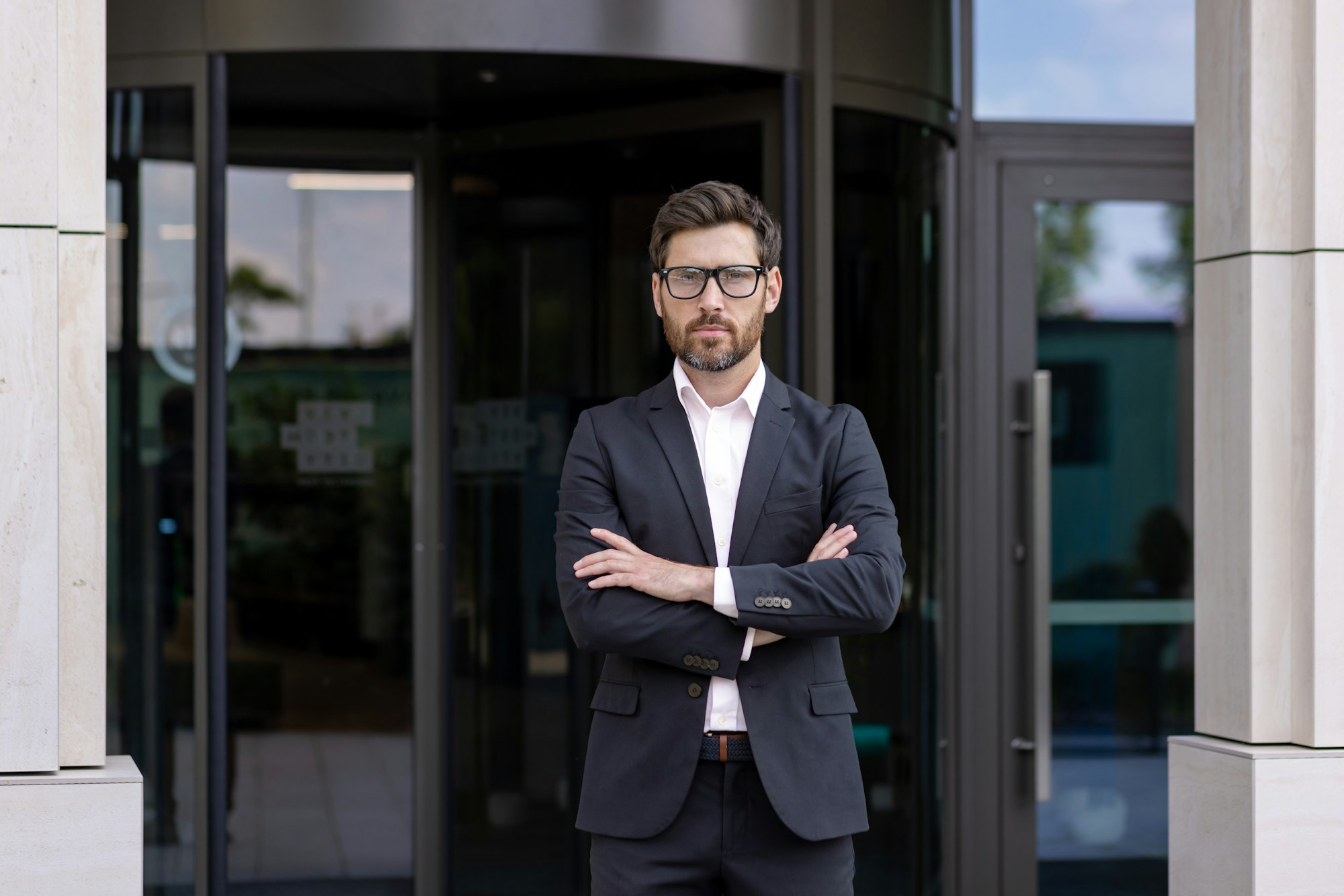 Portrait of a serious and confident male businessman, founder and company owner, standing at the